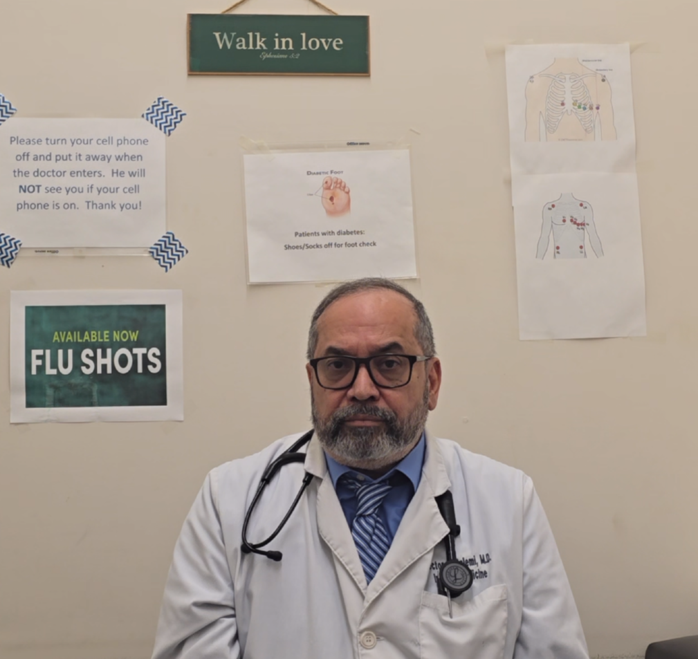 Physician giving a Medical Pages testimonial from an exam room